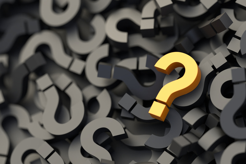 yellow question mark stands out among dozens of black question marks