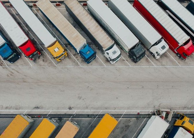 Aerial shot of trucks parked at truck stop
