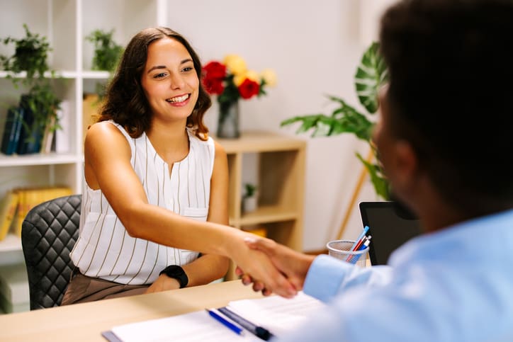 Smiling businesswoman shaking hands