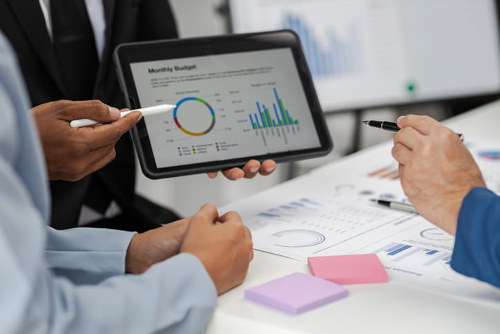 agency manager at a desk reviewing a financial planner